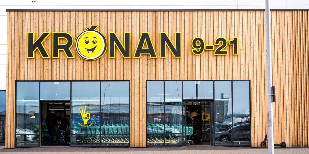 The exterior of a Krónan store, recognized for its bright yellow logo and great deals on fresh produce and groceries